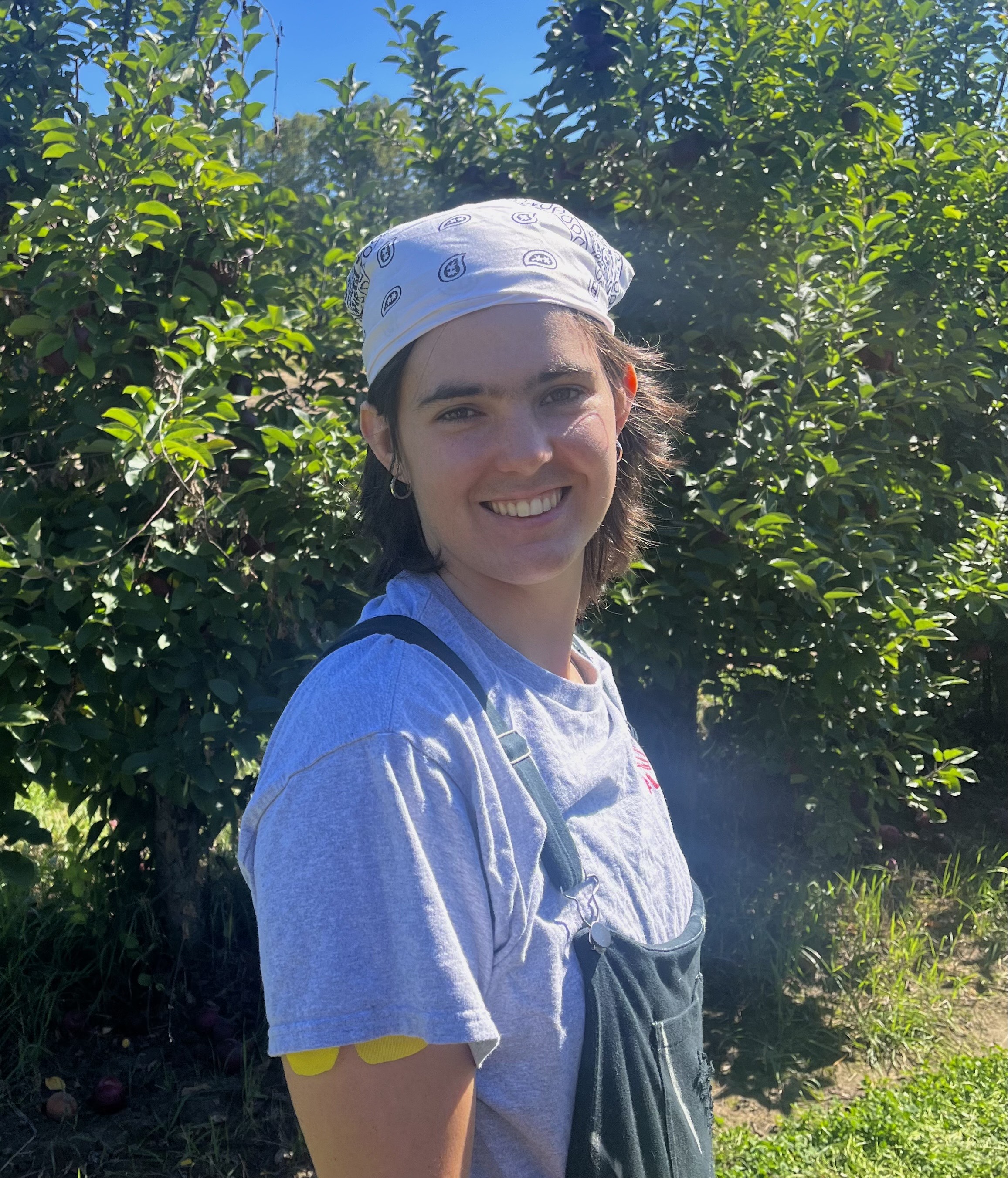 Picture of Terese Mihalcin in an apple orchard